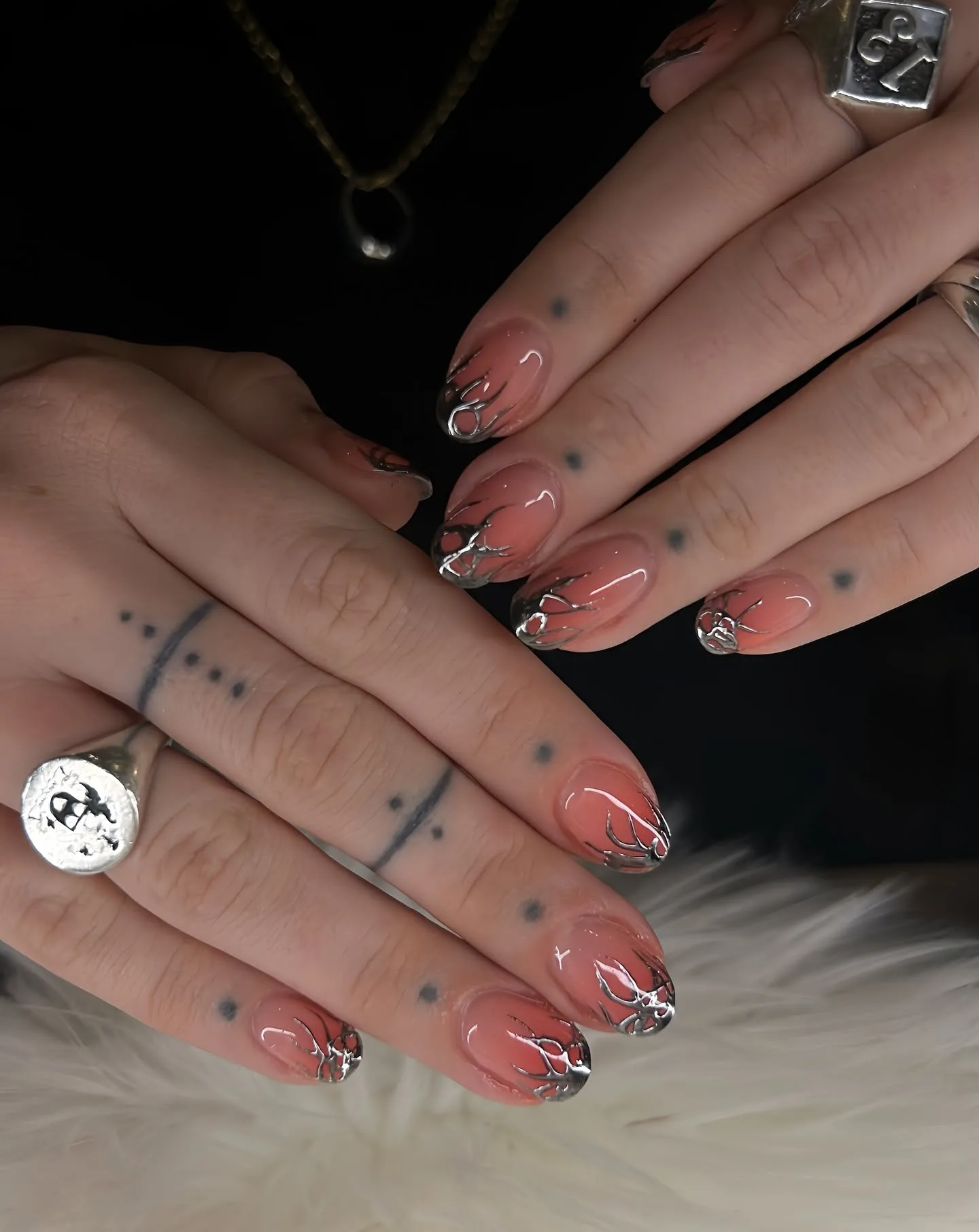 Silver chrome nails with starburst and branch art