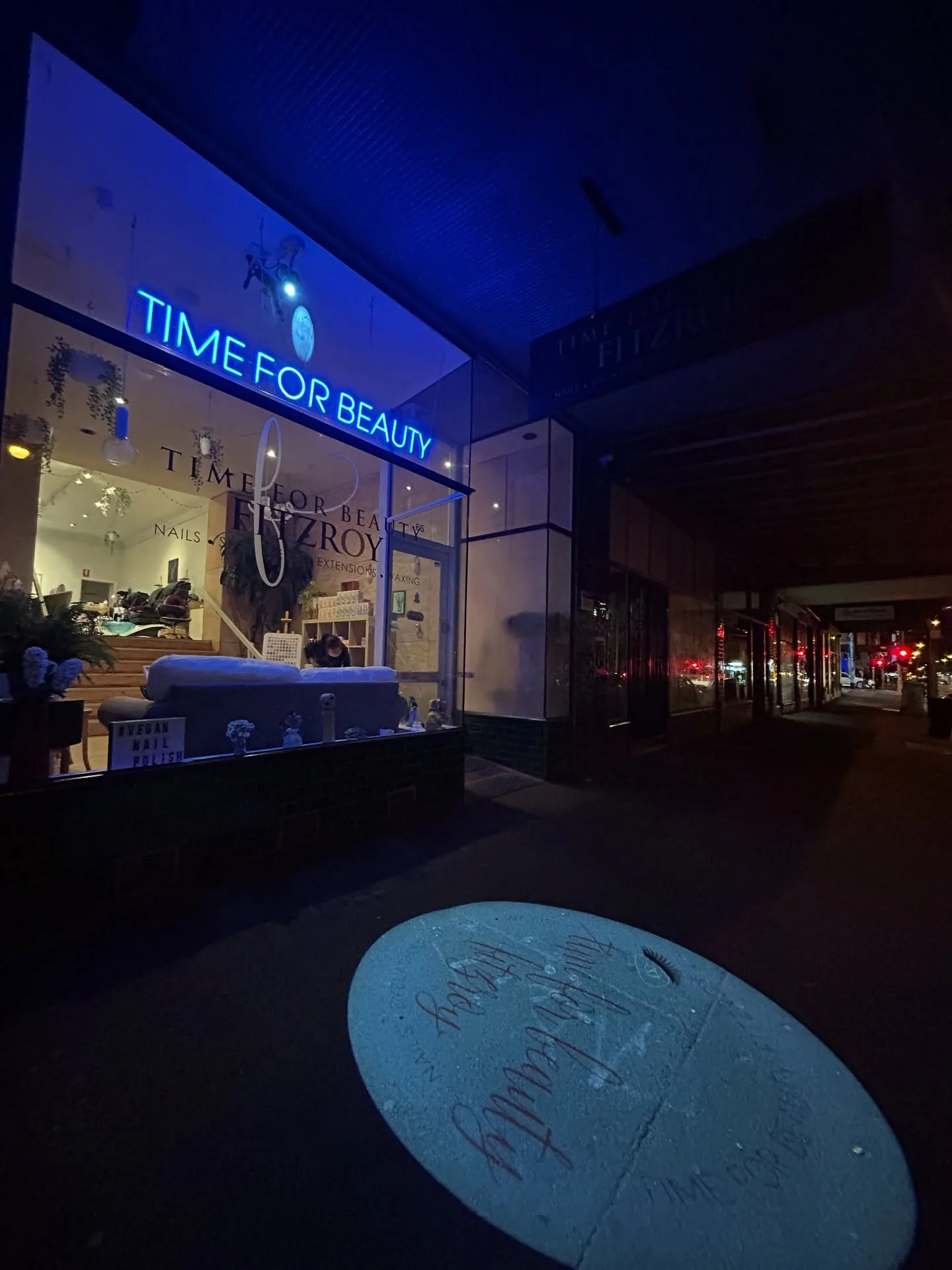 Time For Beauty Fitzroy at night — glowing blue neon sign and lit window display at 65 Smith Street, Fitzroy