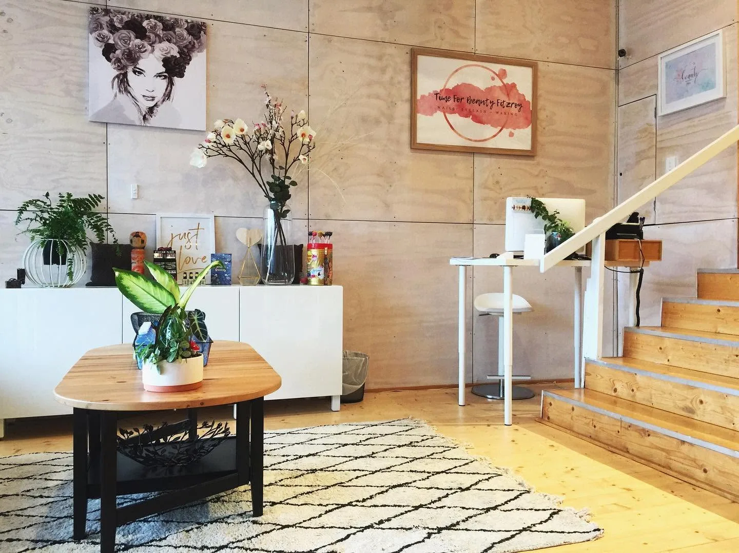 Time For Beauty Fitzroy salon interior — bright reception with blonde-plywood walls, plants and white cabinetry